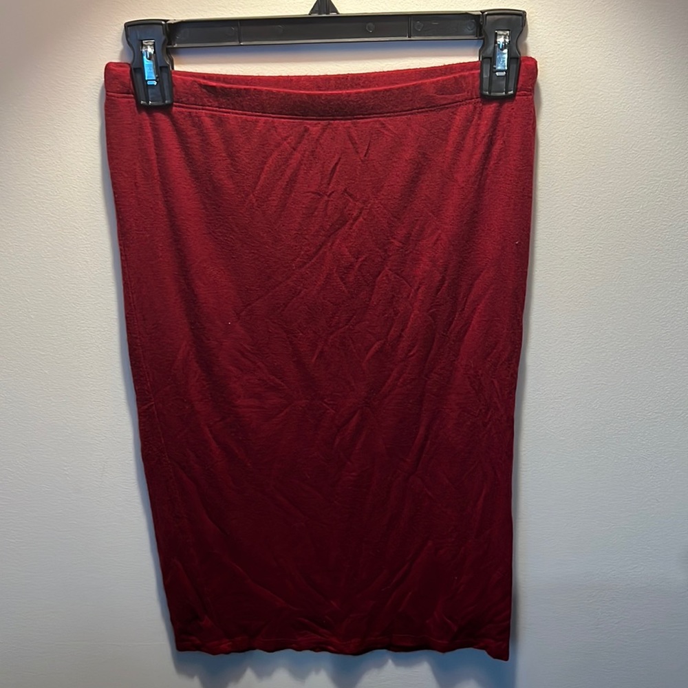 Deep red body hugging knee length skirt with stretchy band